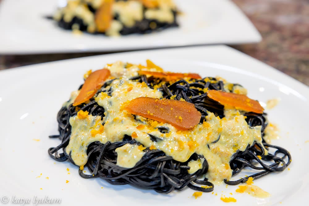Serve pasta with bottarga slices and more sauce.