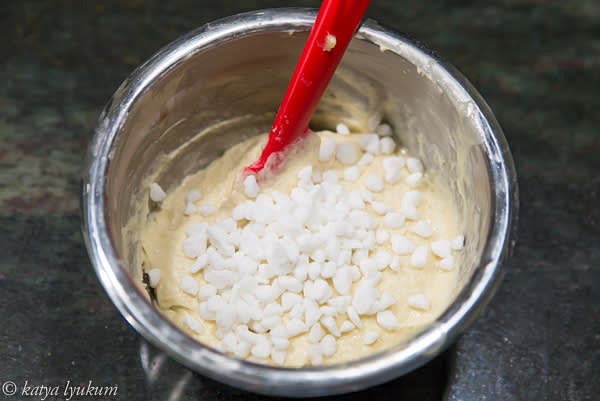After the initial fermentation of dough #1, fold it into dough #2 using a spatula. Add pearl sugar.