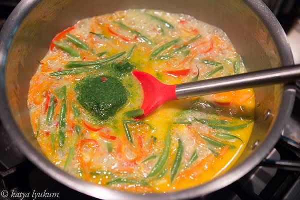 Add peppers and simmer for another minute. To finish, add pesto, stir, and check the taste. Adjust if needed.