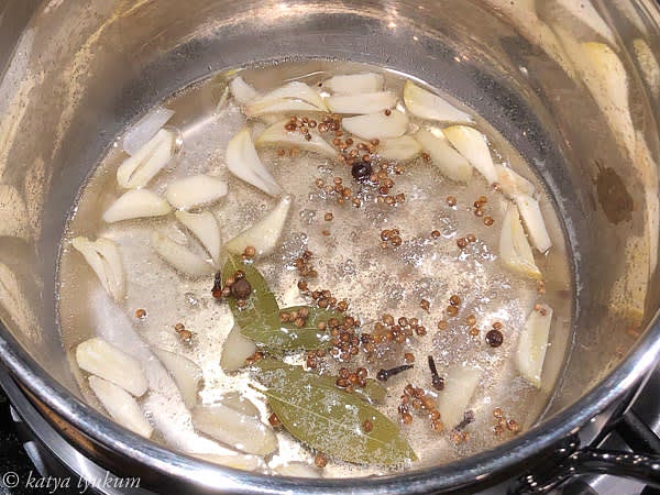 Prepare pickling marinade. Combine all ingredients in a saucepan. Bring them to simmer over high heat, reduce the heat, and let cook for 10 minutes. Strain the solids and return the marinade to the pan.