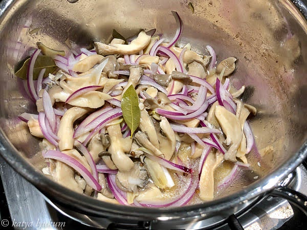 In 15 minutes, the liquid will cook down to about a half cup of concentrated syrup. Turn off the heat and add onions to the hot mushrooms. Stir, give them a few minutes to soften, and they are ready to serve!
