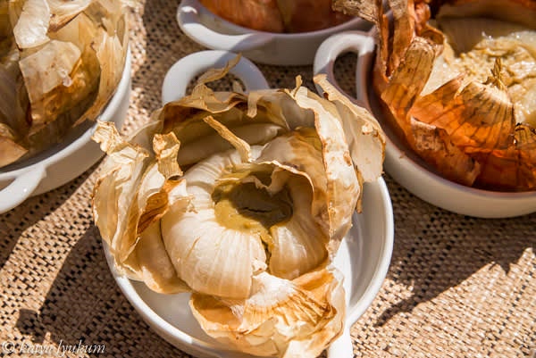 Preheat oven to 350F. Fill onion cups with blended mixture, put them back into the same salt, bake for 45 minutes, turn off the heat, and leave in closed oven until serving time. Serve warm with crusty bread. This appetizer is also good cold, and it can be refrigerated until serving time.