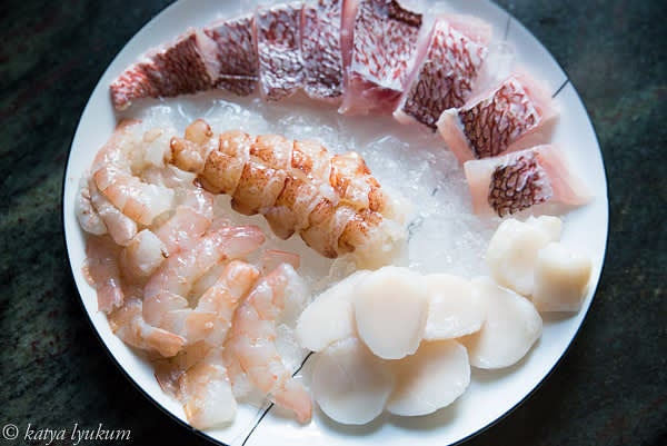 (If cooking to serve, preheat oven to 400F.) Measure 7 oz of pineapple and process it into a smooth puree. Prepare other ingredients for the sauce. Prepare seafood for cooking.
