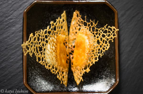 The lace is slightly flexible when hot. Break it into portions around each potsticker and carefully peel it from the bottom of the skillet using a spatula. Place potstickers on paper towels lace down for a few seconds to remove extra oil. And serve.