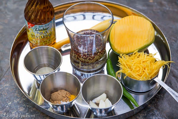 Peel and grate mango. Finely chop green chiles. Measure the rest of the ingredients, reserve 1 tbsp of mustard oil.