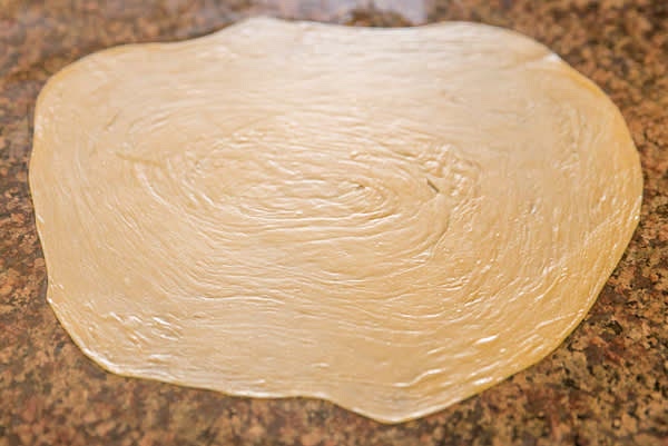 Preheat dry skillet on high. Roll each round of dough twice larger in diameter or to desired thickness.