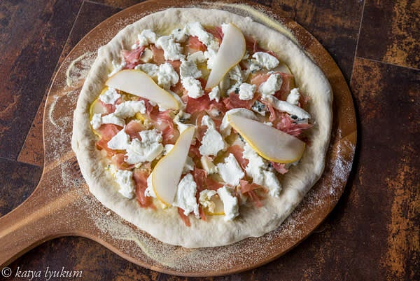 Arrange small pieces of prosciutto on top evenly. Place 4 to 8 more thin pear slices on top.