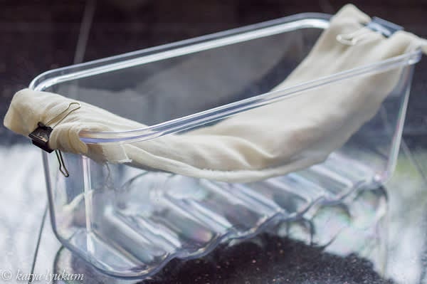 Rinse the breasts under cold running and tap dry with paper towels. Wrap them in cheesecloth and hang them in a container like shown in the picture — this way, cold air can circulate. Do not cover with a lid! Place this container on the top shelf and let the breasts air dry for at least 48 hours or more if you want them more dehydrated.