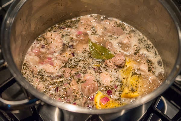 Cover the continence of the pot with COLD water, mix, and bring to boil. Reduce the heat to low, and let simmer uncovered for about 2 hours.