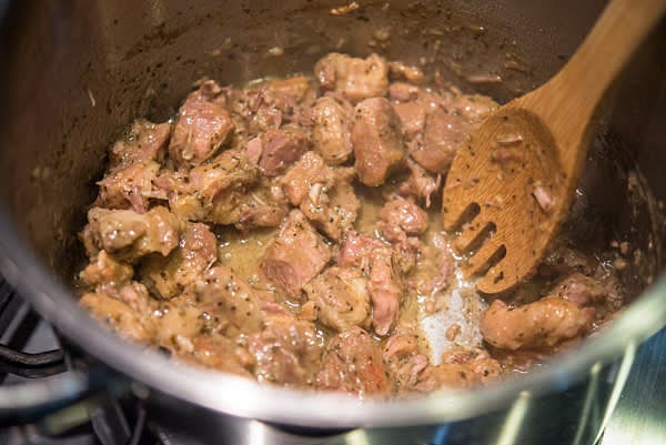 If not, transfer pork pieces to a bowl and let the liquid continue cooking, often stirring, until thick. Then add it back to the meat. At this point, you can add your favorite sauce for additional flavoring. Carnitas can be cooked to this stage in advance and refrigerated until serving.