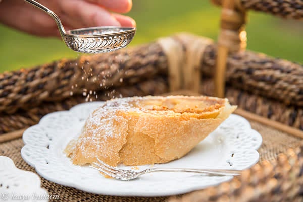 Dust strudel with powdered sugar and slice to portions. Strudel is served warm with vanilla ice cream, Crème Anglaise, whipped cream, or any combination.