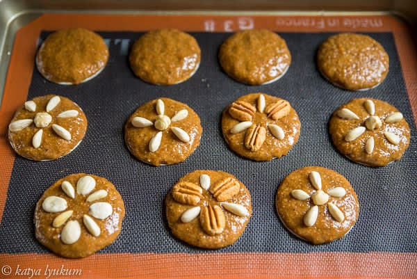 Optional. Decorate cookies with nuts.