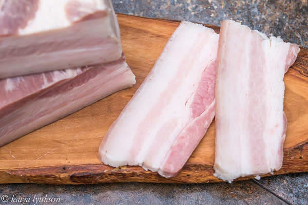 Submerge cooked, packed pork belly into an ice bath (water and ice 1:1) to stop cooking. Remove pork belly from the bags and discard them and the brine. Pat them dry with paper towels, place them in closed containers, and refrigerate them until ready for smoking.