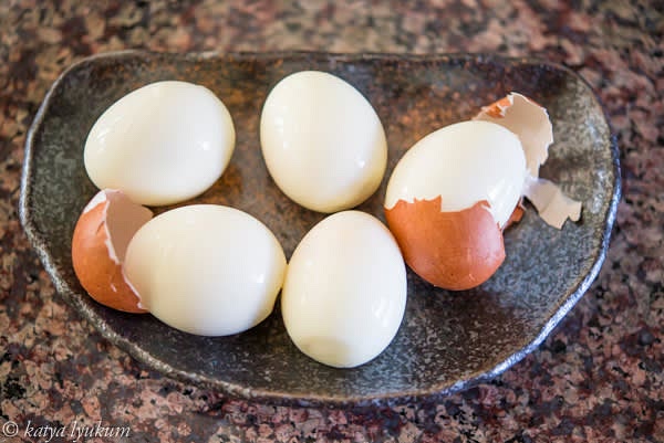Place the eggs into the ice bath and keep them for 15 minutes. This step aims to quickly stop the process of cooking and solidify egg whites, which makes eggshells easy to peel.