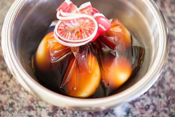 Secure the bag so all eggs are completely covered with the liquid. Refrigerate for up to 2 days. Eggs are ready to eat after the first 6-8 hours of seasoning. Bring them to room temperature before serving. They are reheated in the hot stock then sliced with a sharp knife or thread.