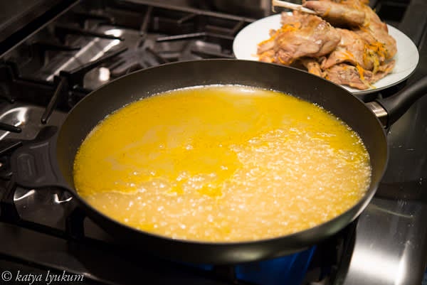 Place the largest skillet you have (the larger the diameter, the faster you'll be able to evaporate water from the stock) on high heat and cook down the stock into a syrupy sauce.
