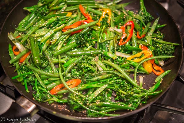 While the meat is marinating, prepare all the vegetables for stir fry. Place a large skillet or wok over high heat and add oil. When oil starts smoking, add vegetables, season them with salt and pepper and stir fry them for a couple of minutes. Turn the heat off.