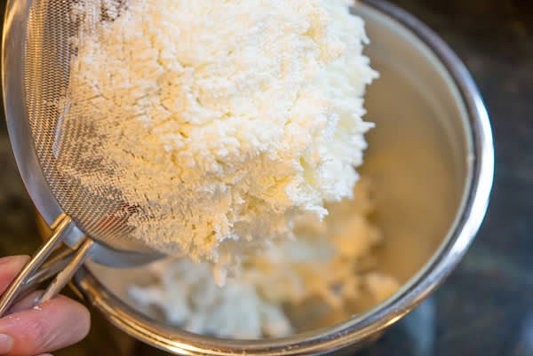Press kefir cheese through a sieve — Important! Please do not skip it!