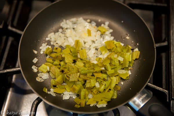 Heat the olive oil in a large frying pan over medium heat. Add onions and saute until sweet and fragrant, slightly golden. Add diced hatch peppers, stir, and cook for 1 minute.