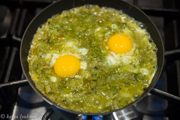 Make 6 indentions in the sauce. Gently break the eggs and pour each egg white into each indention. Use a fork to swirl the egg whites a little bit with sauce. Simmer on low heat for 5 minutes. Add egg yolks into each indention and cook for 5 more minutes. Remove from heat and let eggs settle for a few more minutes before serving.