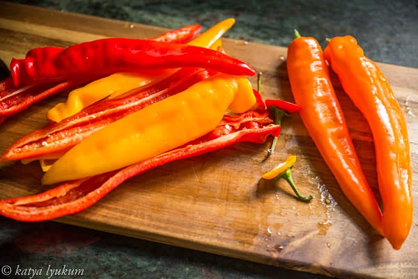 Remove the stem end and cut the peppers in half lengthwise. Remove seeds and veins.