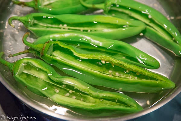 Fill a large pot with enough water to blanch peppers. Bring it to boiling over high heat. Using a sharp knife, cut off long triangles on one side of the peppers and reserve them. You can remove the seeds before or after the blanching. Add salt to the boiling water to make it sea-salty. Blanch peppers for 3-5 minutes, making sure they are submerged.