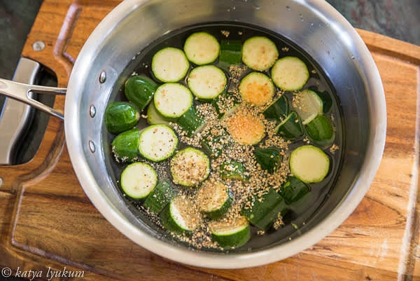 Transfer the rounds to a pot and add cold water to cover the zucchini to the top. Add salt and toasted garlic and bring to boiling over high heat. Reduce the heat to a minimum and simmer until zucchini is soft. It should take about 5 minutes.