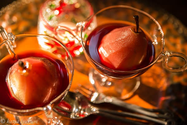 Carefully transfer pears into a container and strain wine. Discard spices. Gently reheat pears and wine before serving.