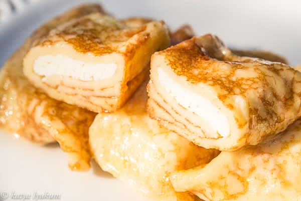 In advance, you can make them in a large baking dish, let cool, and refrigerate covered. When cold, crepes are firmer and easier to handle and serve. You can slowly warm them in the oven before serving.