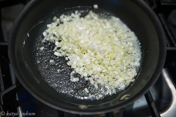 Preheat oven 400F. Melt butter over medium heat and saute onions in a small frying pan. Let cool.