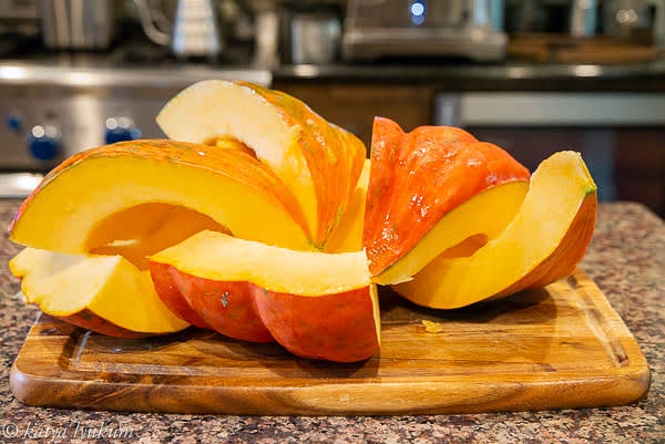 Wash, cut, and scrape clean the pumpkin. I usually quarter it vertically and then cut each quarter in half horizontally.