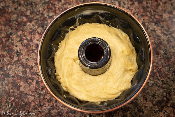 Shape the dough into a long cylinder and gently place it into the mold on the almonds. Make sure there is no air trapped between the almonds and the dough. Your mold should be half-filled or less.