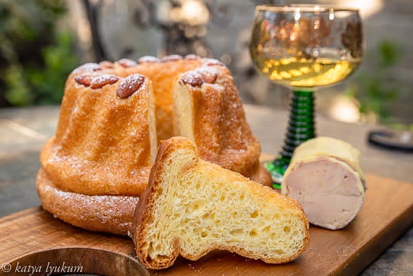 Bake for about 40-45 minutes until the top is golden brown. Immediately take the cake out of the mold, brush it with melted butter, and dust with sugar. Let cool to room temperature and serve.