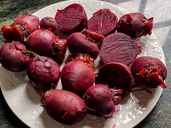 Clean and trim the beets. In a pot with a lid, bring one cup of water to boiling. Place a steaming basket with beets inside, cover, and steam for 15 minutes. Instant Pot instructions: Clean and trim the beets. Place them into the insert in a steaming basket and add 2 cups of water. Pressure steam them manually for 7 minutes with natural release.