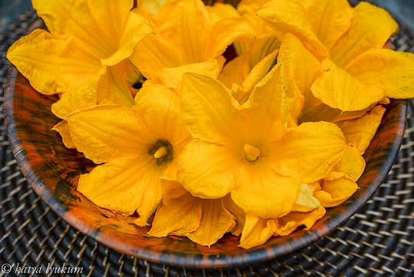 Zucchini and cucumber flowers are open for a few hours in the morning. Then they close for the rest of the day. Get them freshly cut in the morning of the same day.