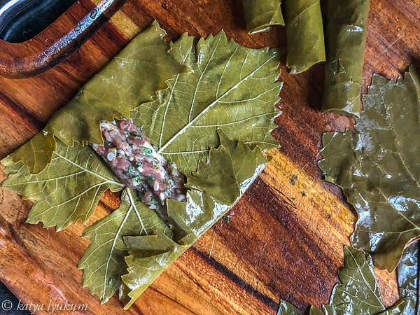 Roll dolma placing leaves smooth side down. Stuff each leaf with about 2 tsp of the lamb mixture, as shown in the pictures.