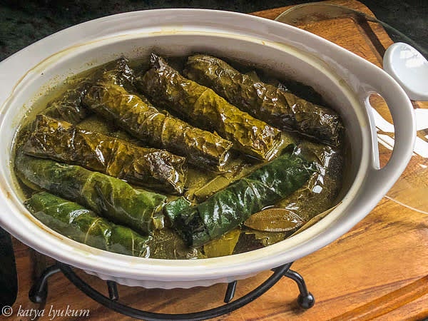 Place the rolls into a deep roasting dish, add enough stock to cover them, cover with a lid or foil, and cook in the oven for an hour.