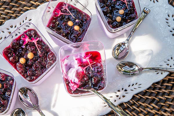 Spoon at least 2 tbsp (up to 6 tbsp) of compote on top of the panna cotta and refrigerate for another 2 hours. You can also serve panna cotta with fresh berries, syrups, and sauces of your choice. You can top it with additional ingredients that bring more exciting flavors and textures to a combination — sugared fragrant flower petals, chocolate pearls, caramelized nuts. I like panna cotta decorated with edible flowers. Panna cotta can be frozen if needed.