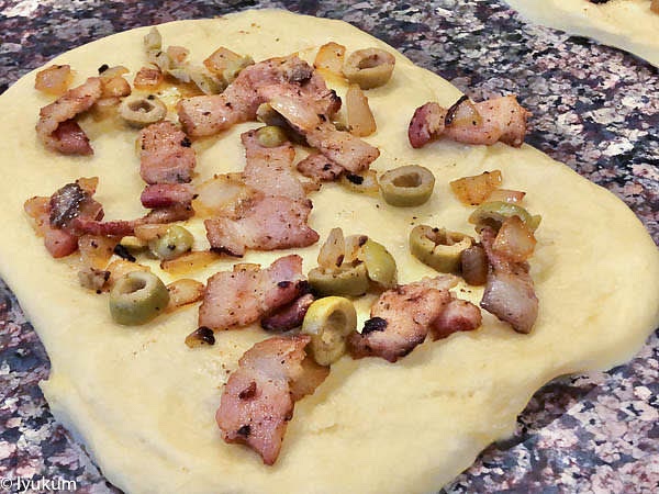 Roll each portion of the dough into 7.5" by 7.5" square. Spread 3 tbsp of the stuffing and shape rolls. I am one of those who feel an urge to add more stuffing than needed. Remember, the more stuffing, the more moisture will be inside the brioche roll, which will cause sizeable inner air pockets. Don't be greedy!