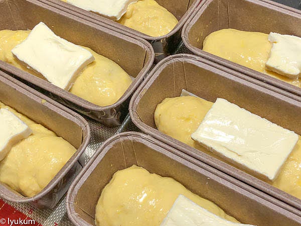 When ready to bake, use a silicone brush to apply a thin layer of eggwash on every pie. Slice cold brie and arrange a slice on top of each roll.