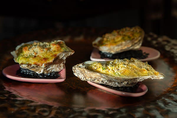 Prep serving plates by spooning a little bit of rock salt for every oyster shell. Serve hot or warm. Bon appetite!