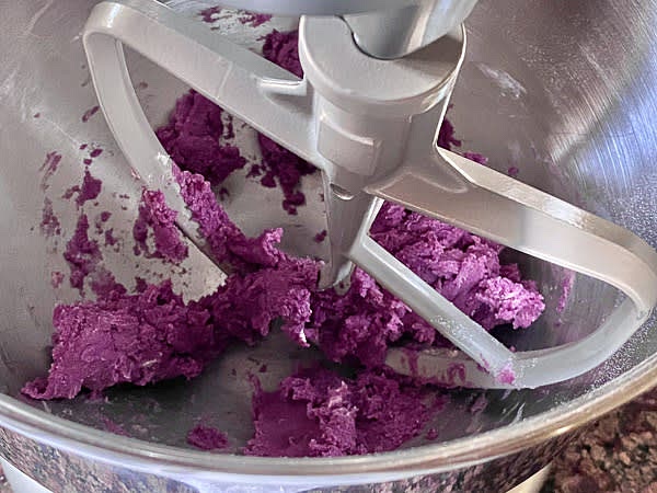 Add softened at room temperature butter and make a paste using a spatula or K-shaped attachment and stand mixer, low speed.