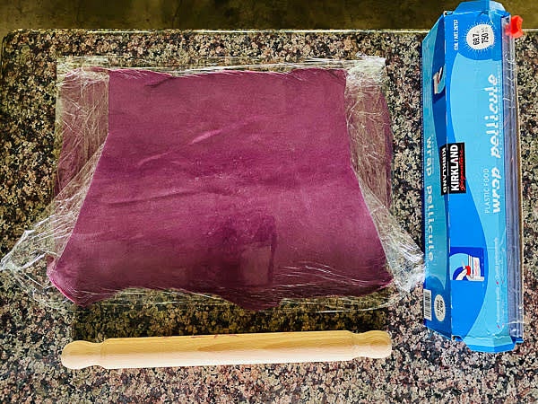 Place the paste between two layers of plastic wrap and roll the paste into a rectangular as shown in the picture (about tabloid size 13" x 19").