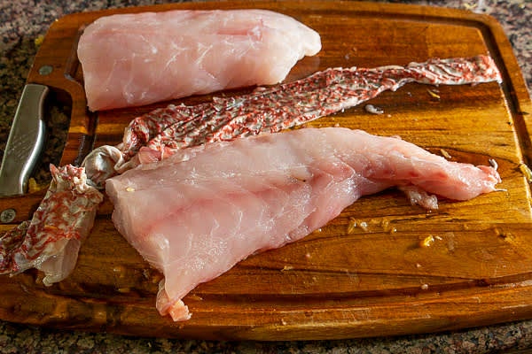 Check Red Snapper fillet for bones and remove the skin.