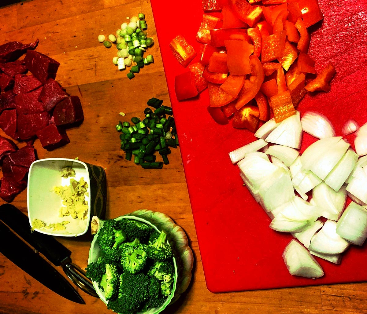 Pat meat dry, then toss with 3 teaspoons cornstarch. Stir together broth, ginger, black-bean sauce, sugar, sesame oil, and remaining 1 teaspoon cornstarch in a bowl. Measure 2 tablespoons water in a separate small bowl and set aside. Cut onion and pepper into 1 inch chunks