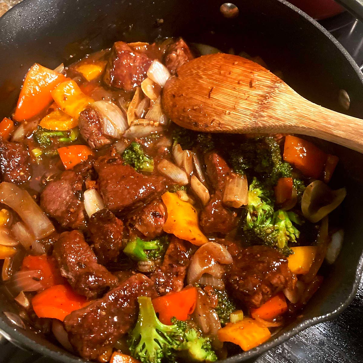 Add white and light-green parts of scallion to skillet along with meat and any accumulated juices. Stir in black-bean-sauce mixture and toss until evenly coated and sauce has thickened, about 30 seconds. Serve with rice, sprinkled with scallion greens.