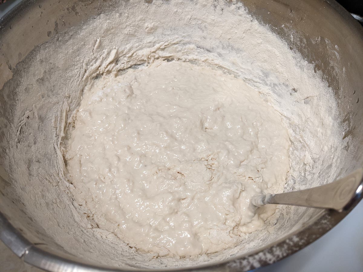 Stir in 1 cup of flour at a time until dough thickens (probably about 5 more cups).