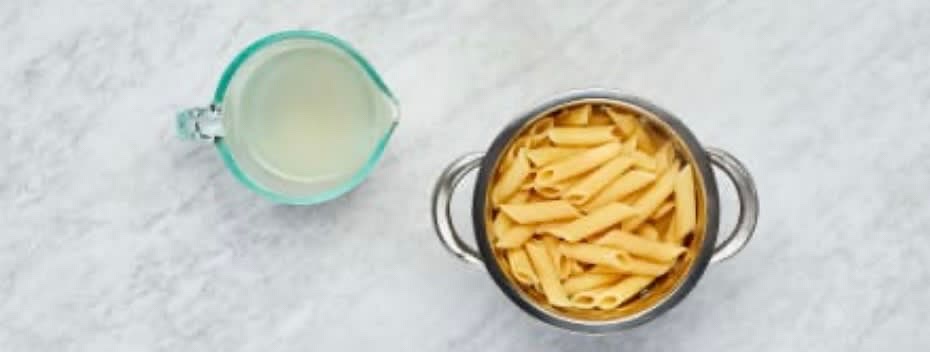 While veggies roast, bring a large pot of salted water to a boil. Peel and finely chop garlic. Trim and thinly slice scallions, separating whites from greens. Zest and quarter lemon. Once water is boiling, add pasta to pot; cook, stirring occasionally, until al dente, 9-11 minutes. Reserve ½ cup pasta cooking water, then drain and set aside. (Keep empty pot handy for the next step.)