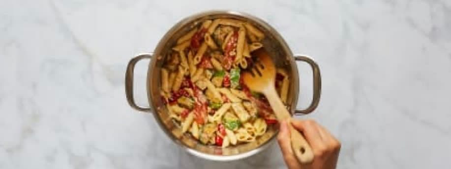 Stir ⅓ cup plain water (½ cup for 4 servings) into pot until combined, then add half the Parmesan (save the rest for serving) and lemon zest to taste. Stir in drained pasta, roasted veggies, and splashes of reserved pasta cooking water as needed until everything is coated in a creamy sauce. Stir in a squeeze of lemon juice and season with salt and pepper.