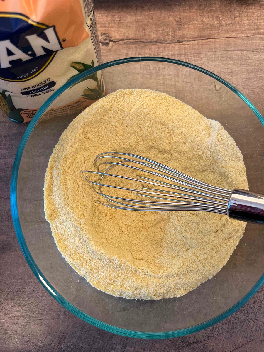 Mix the precooked cornmeal and the salt. Add the water and whisk remove any lumps, then stir until combined. Let the mixture rest for 5-10 minutes.
